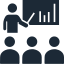 Icon of a person giving a presentation, pointing at a bar graph on a board, with four audience members seated in front.