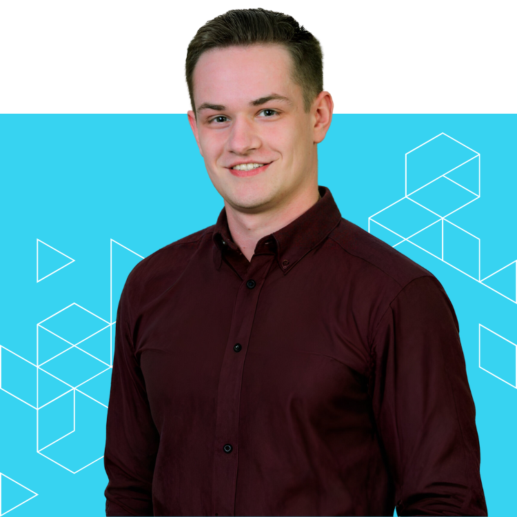 A young man with short brown hair wearing a maroon button-up shirt stands smiling in front of a bright blue background with white geometric line patterns.